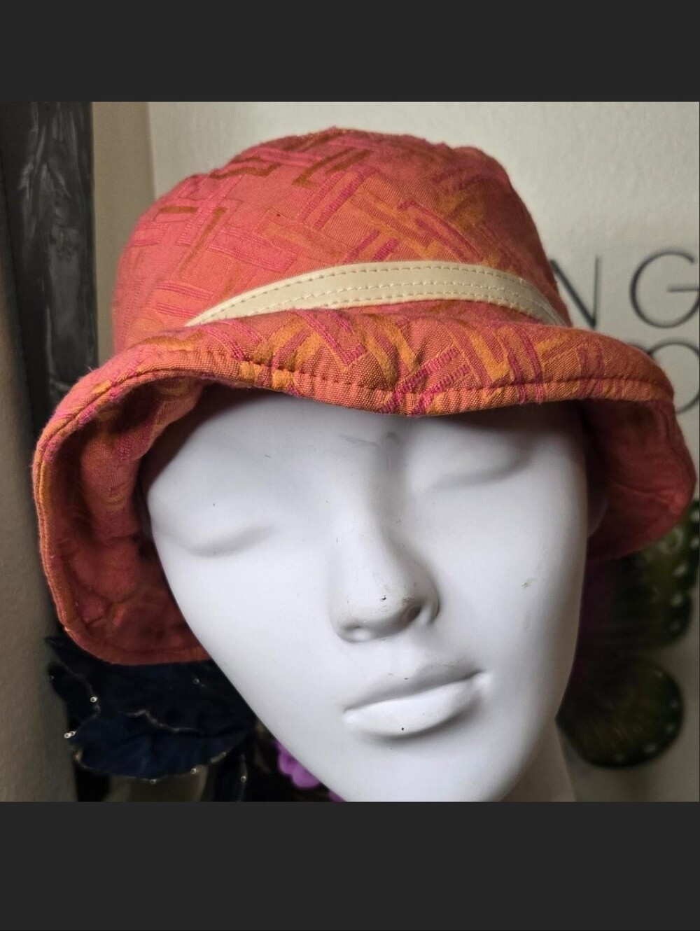 Jaclyn Smith geometric print bucket hat featuring a vibrant orange and pink bask